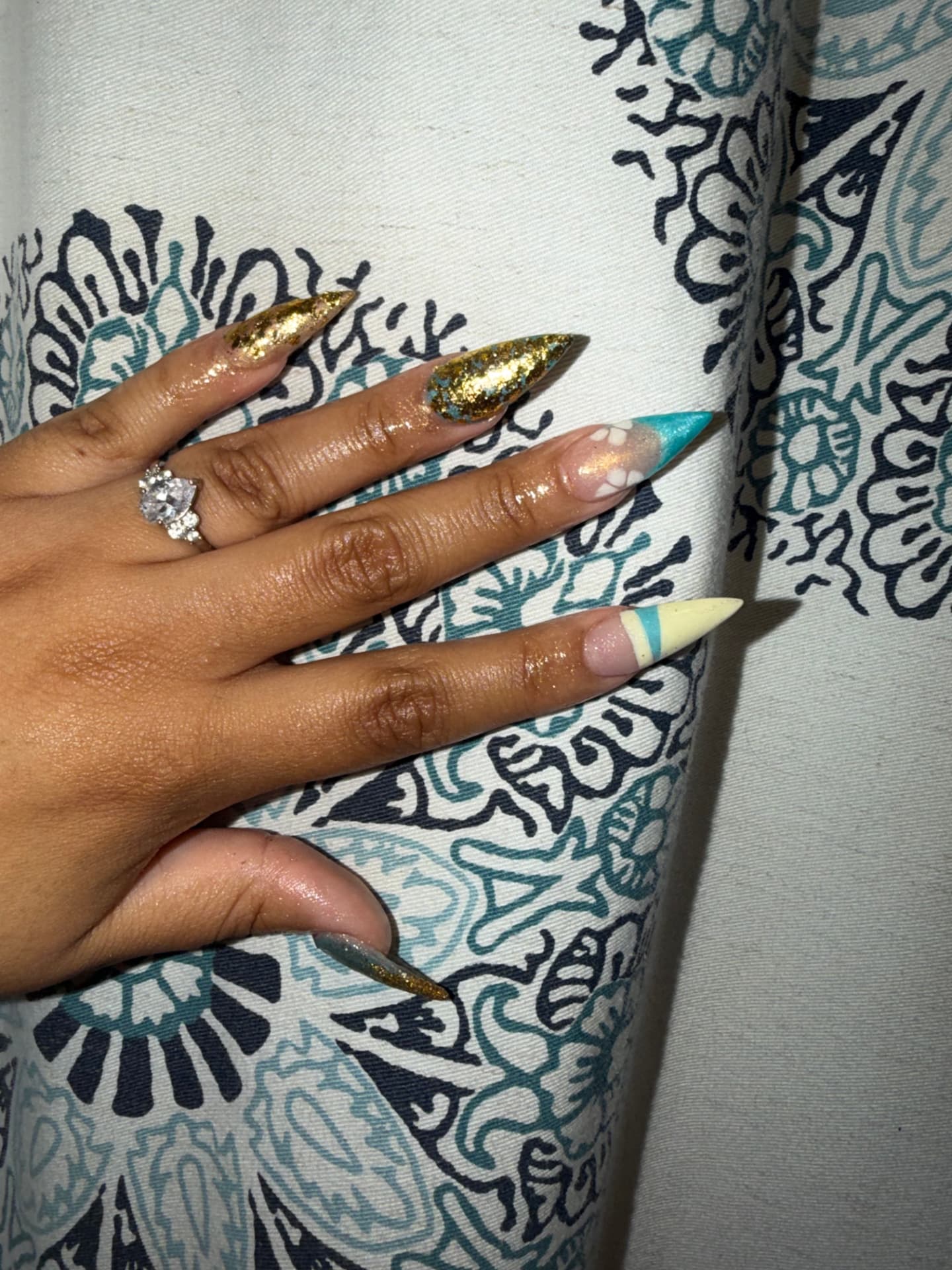 Gold glitter and turquoise stiletto set with floral accents